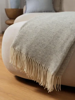 Coperta in lana con motivo a zig-zag e frange Tyrol