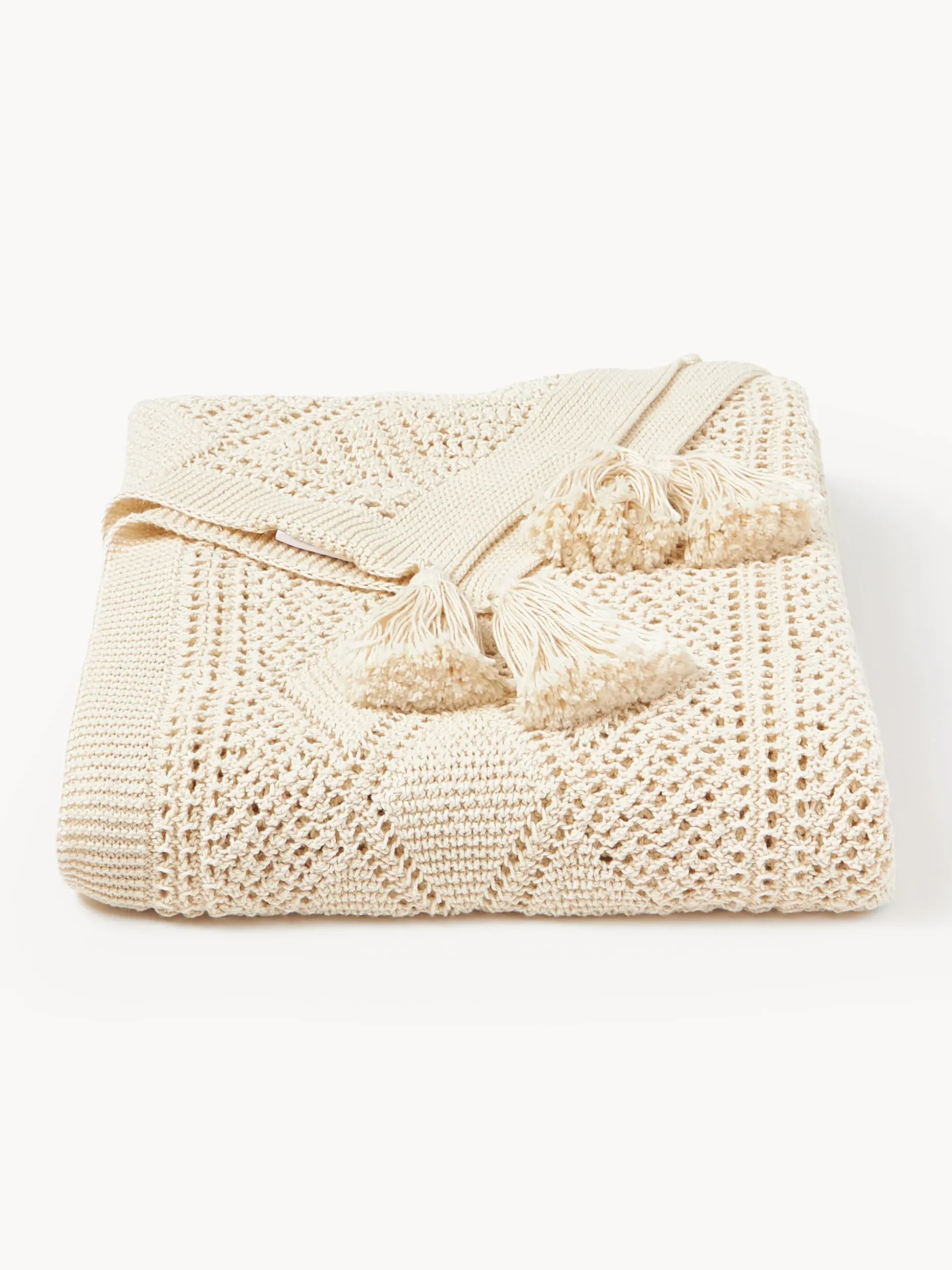 Coperta lavorata a maglia con nappe Sarah