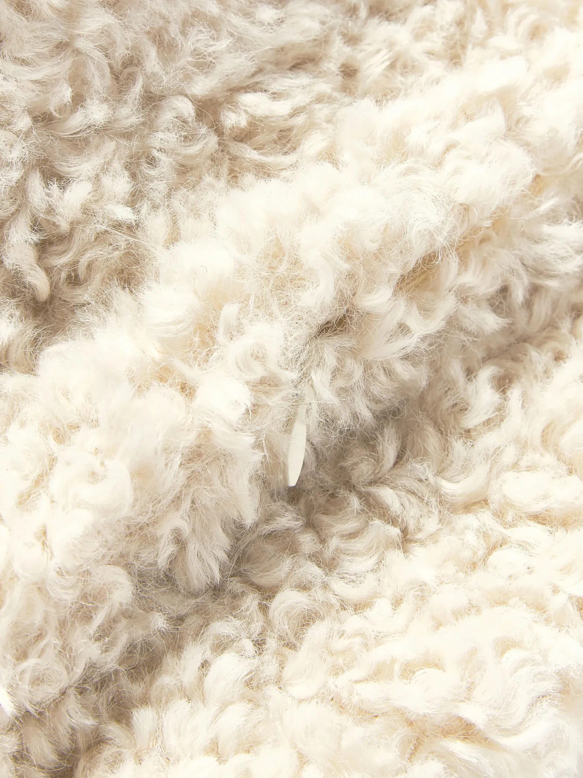 Copricuscino in teddy Dotty