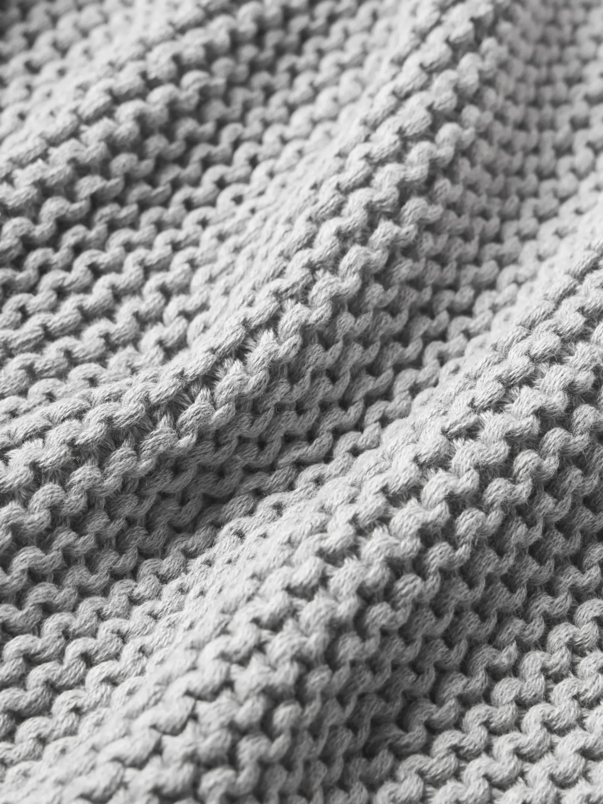 Copricuscino lavorato a maglia in cotone organico Adalyn