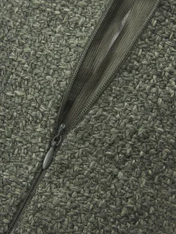 Cuscino rullo in bouclé con bordino Aya