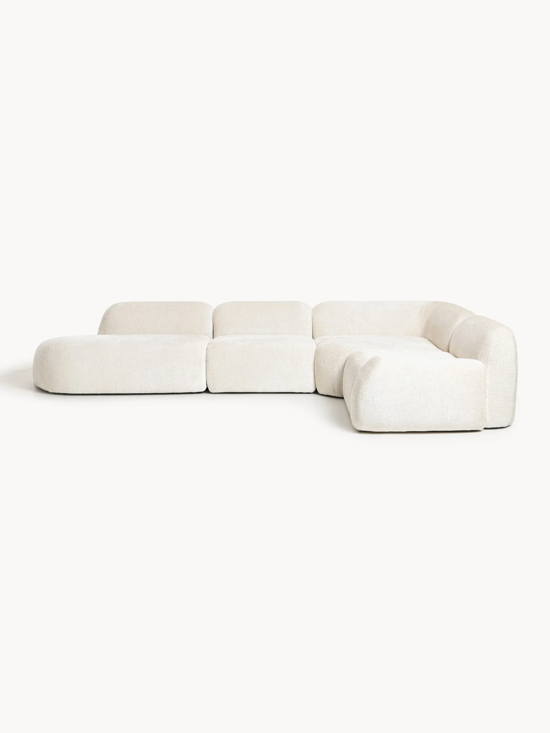 Divano angolare componibile 4 posti con chaise longue in teddy bouclé Wolke