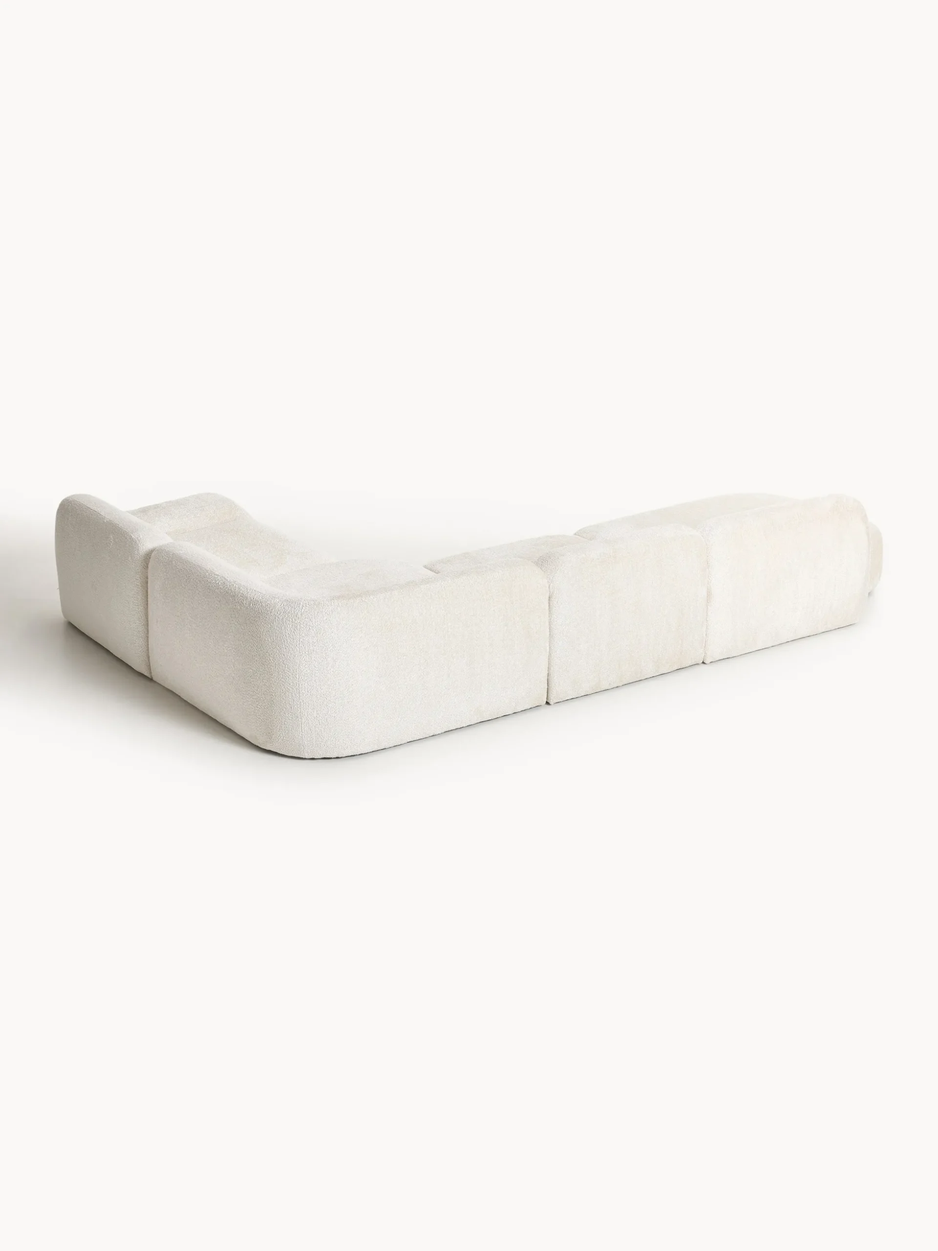 Divano angolare componibile 4 posti con chaise longue in teddy bouclé Wolke