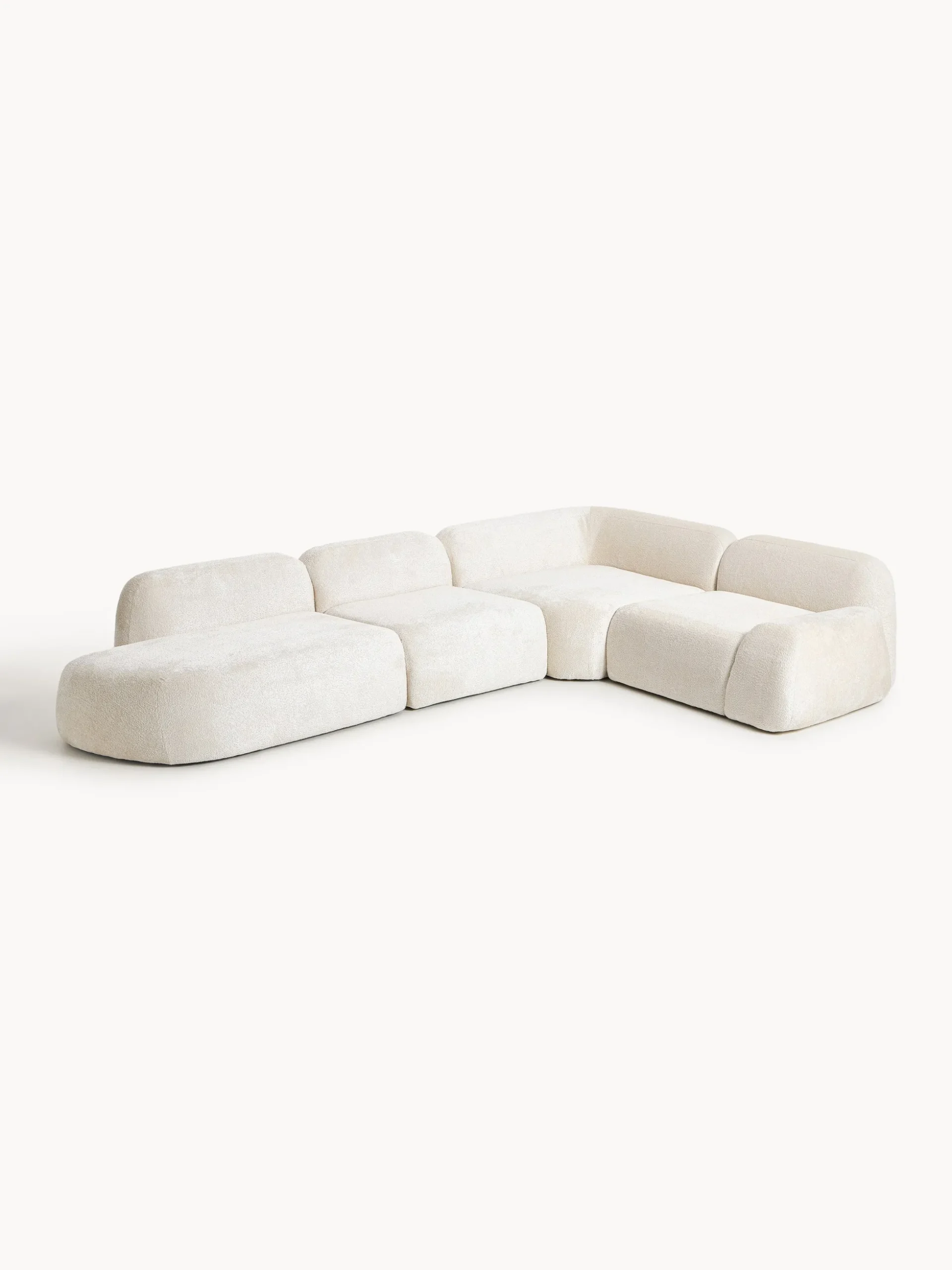Divano angolare componibile 4 posti con chaise longue in teddy bouclé Wolke