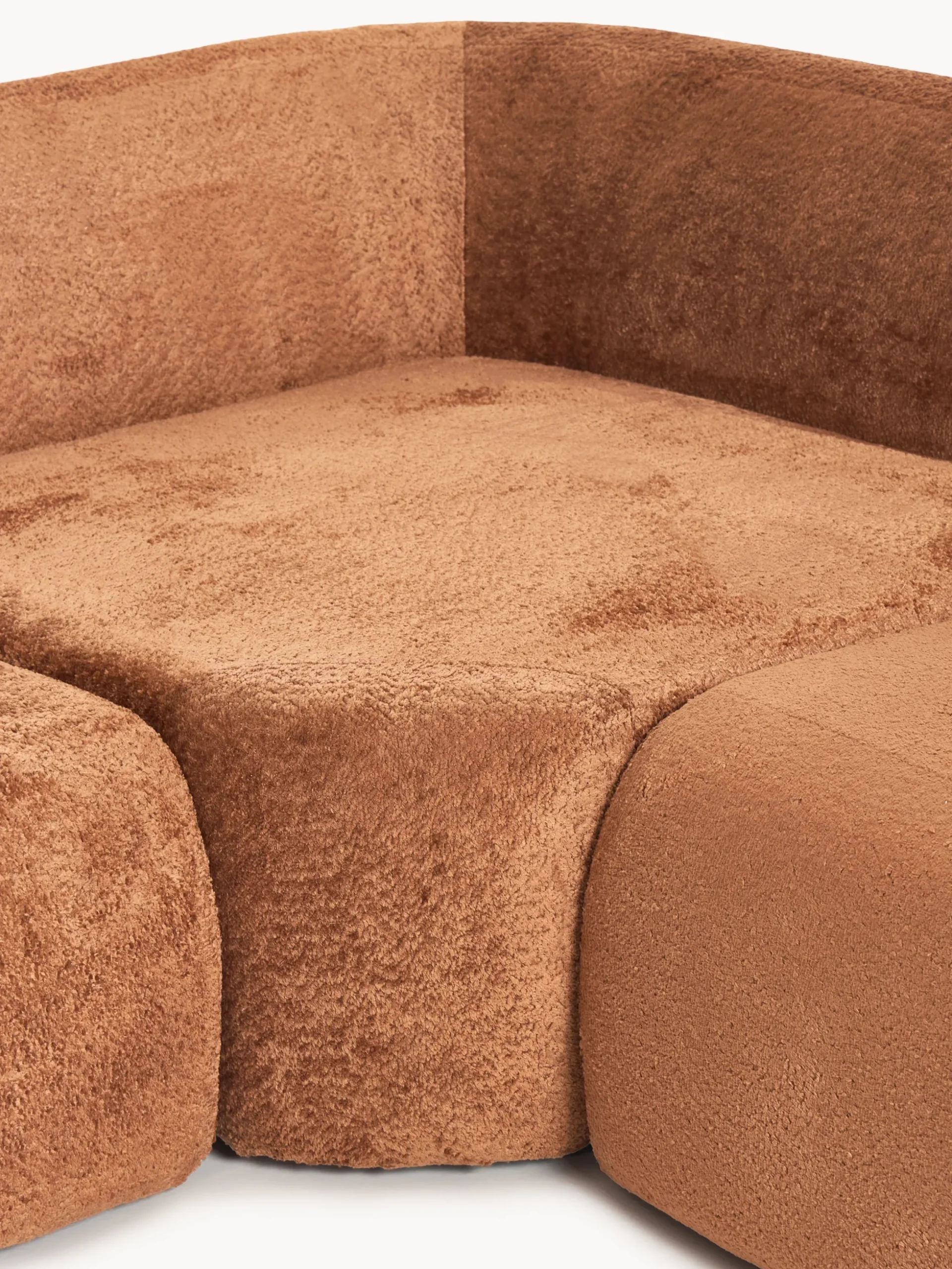 Divano angolare componibile 4 posti con chaise longue in teddy bouclé Wolke