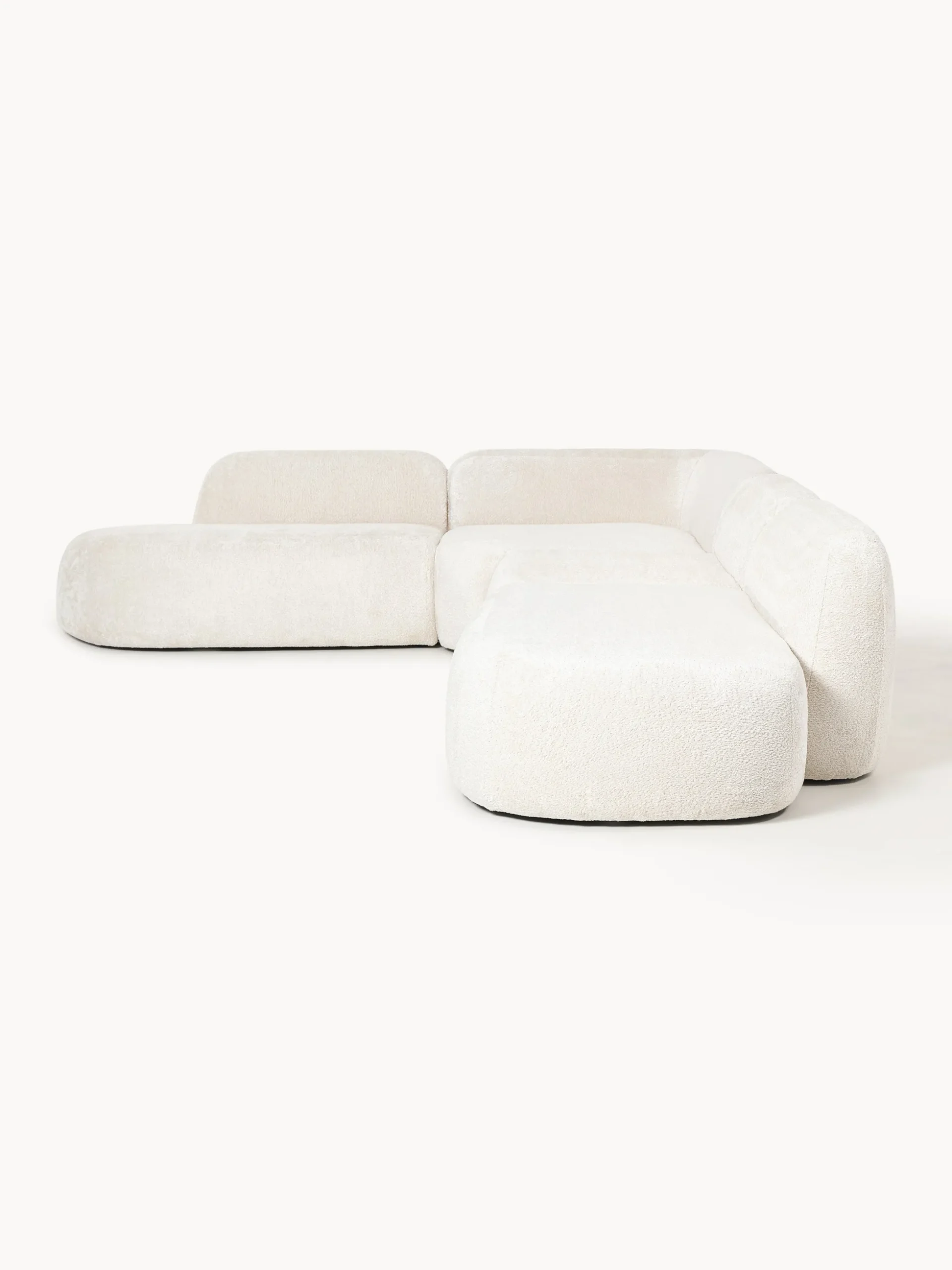 Divano angolare componibile 4 posti con chaise longue in teddy bouclé Wolke