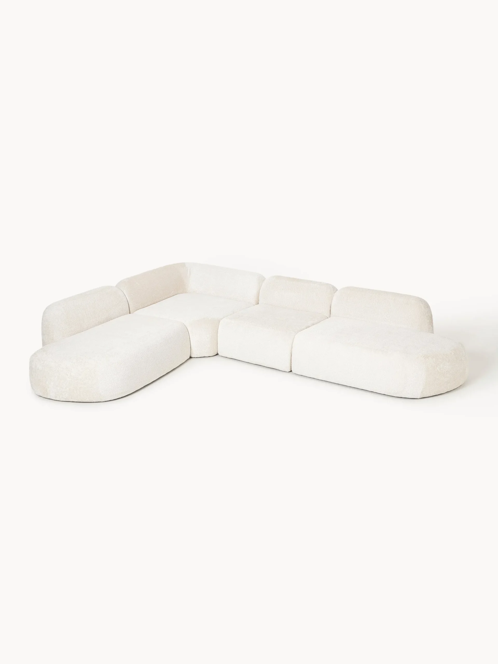 Divano angolare componibile 4 posti con chaise longue in teddy bouclé Wolke