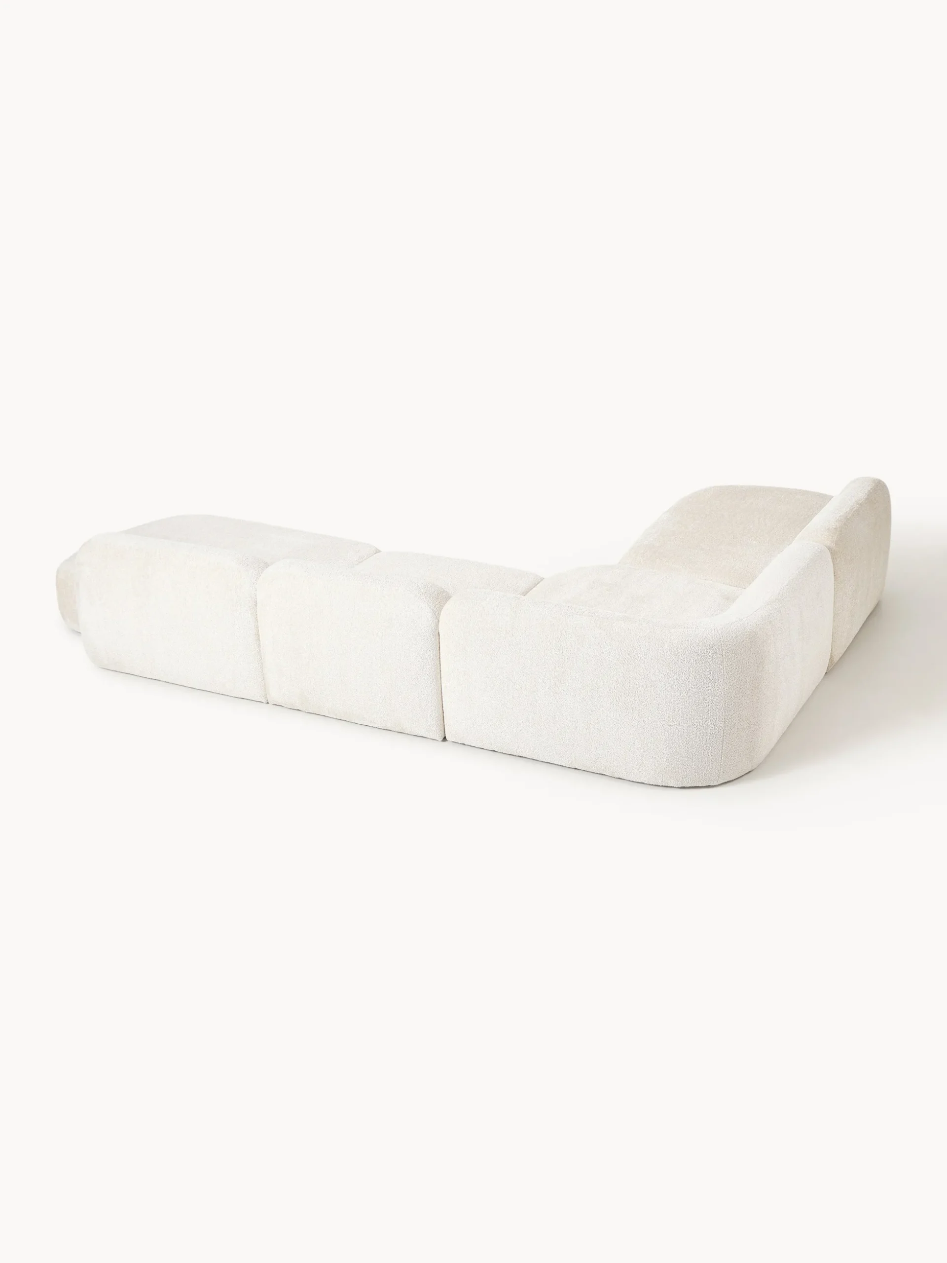 Divano angolare componibile 4 posti con chaise longue in teddy bouclé Wolke