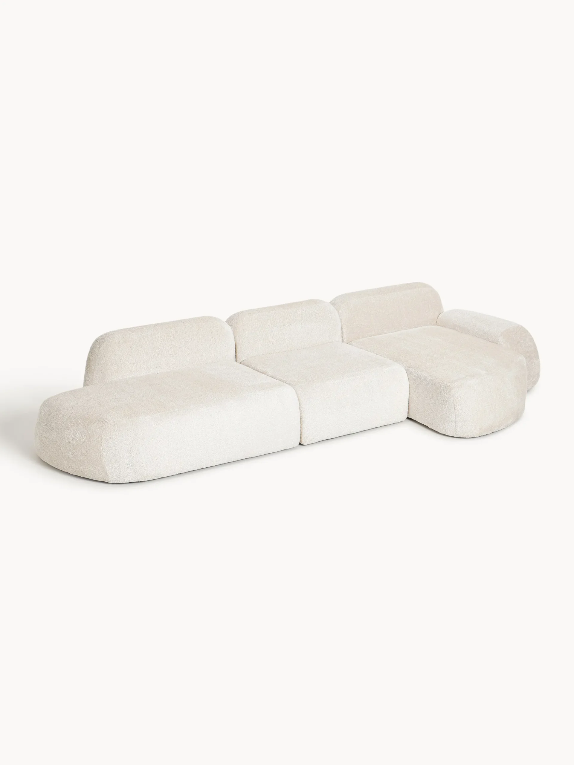 Divano angolare componibile 4 posti con chaise longue in teddy bouclé Wolke