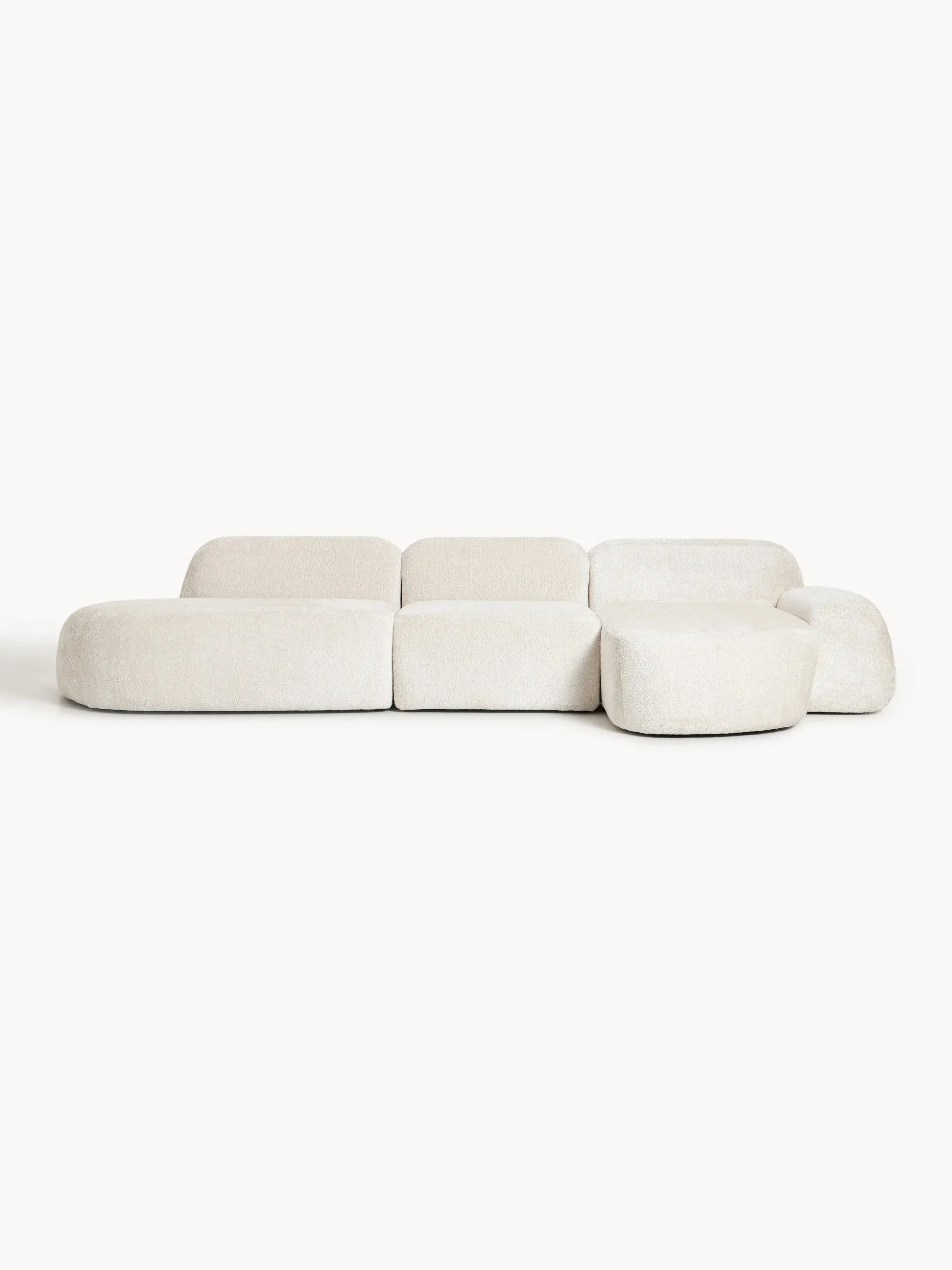 Divano angolare componibile 4 posti con chaise longue in teddy bouclé Wolke
