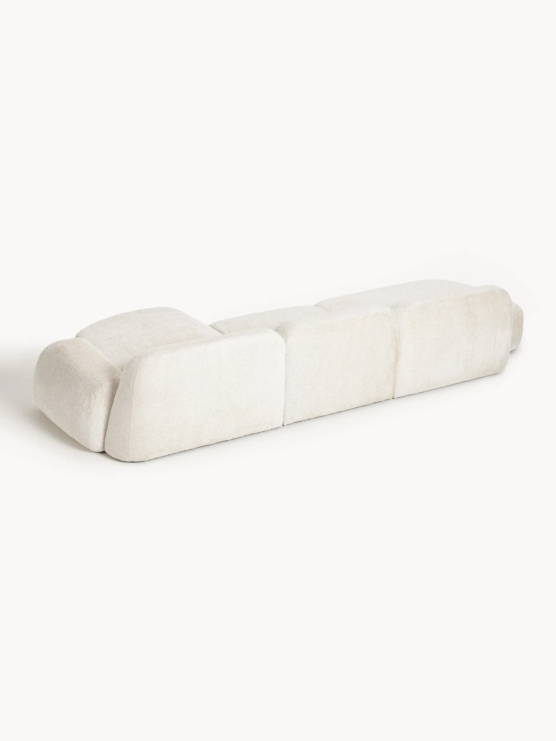 Divano angolare componibile 4 posti con chaise longue in teddy bouclé Wolke