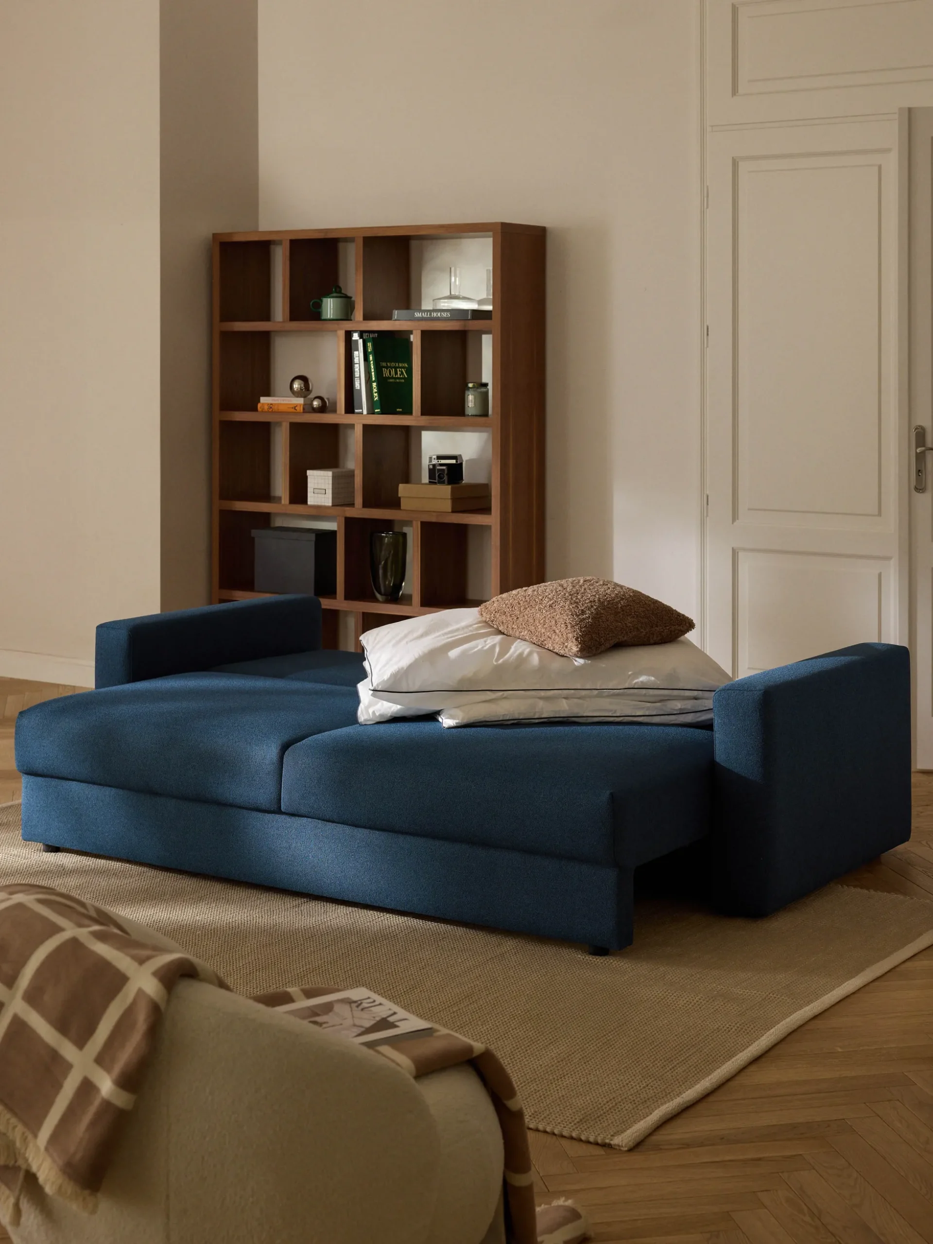 Divano letto 3 posti in bouclé con vano contenitore Tasha