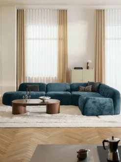 Divano angolare componibile 4 posti con chaise longue in teddy bouclé Wolke