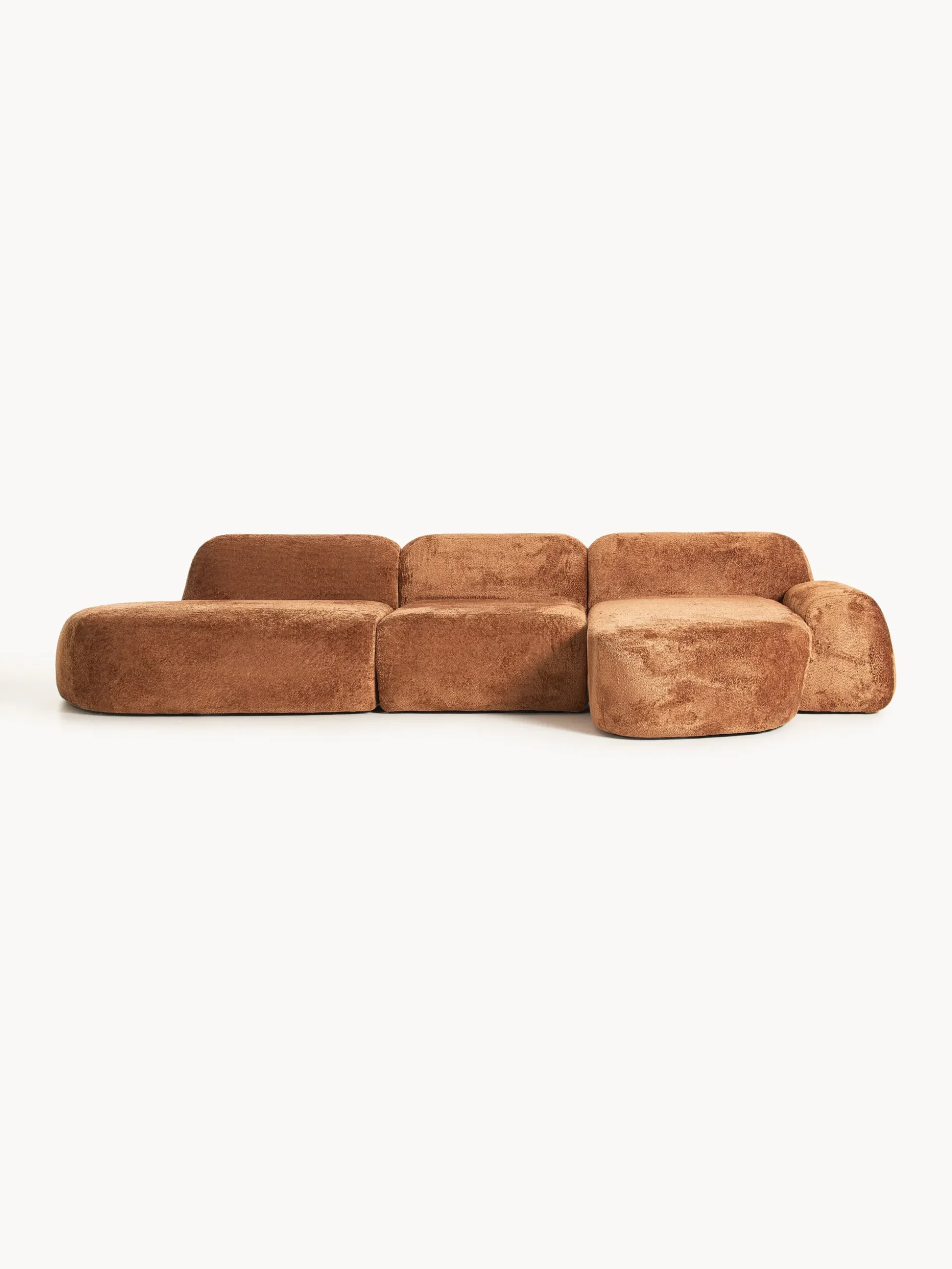 Divano angolare componibile 4 posti con chaise longue in teddy bouclé Wolke