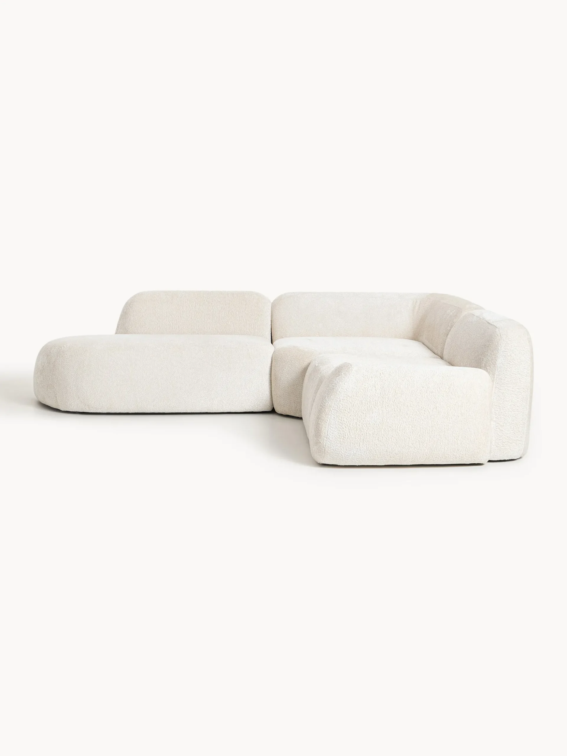Divano angolare componibile 4 posti con chaise longue in teddy bouclé Wolke