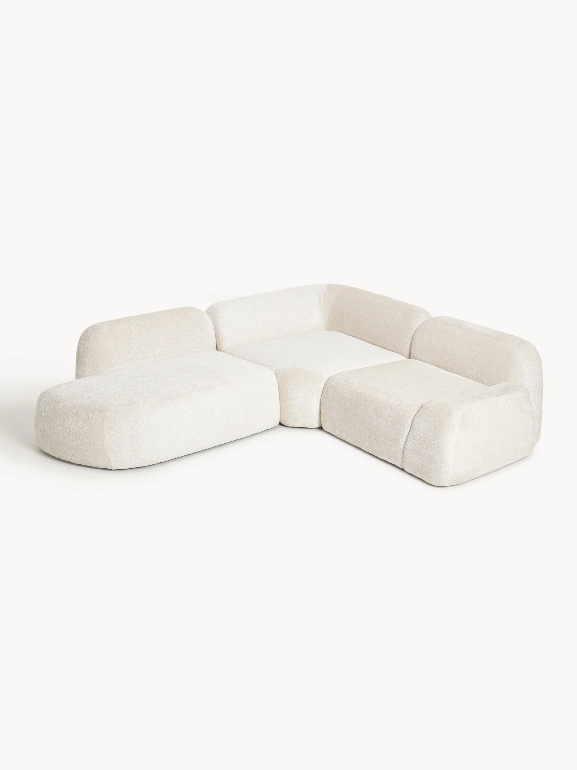 Divano angolare componibile 4 posti con chaise longue in teddy bouclé Wolke
