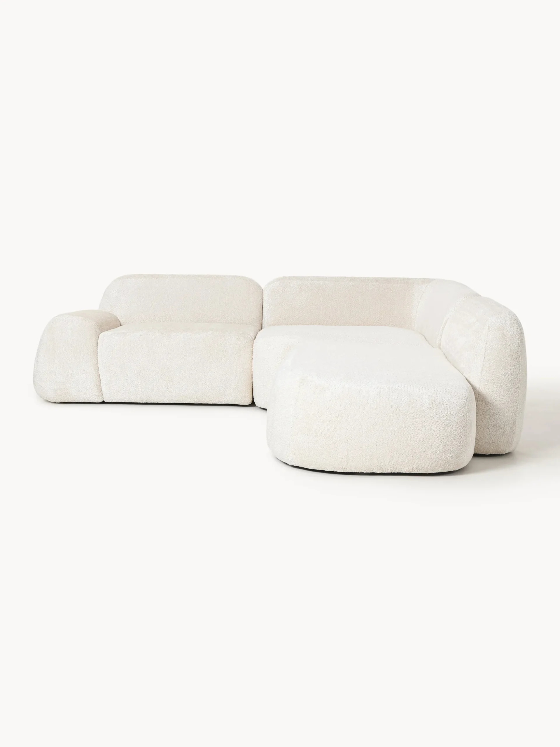 Divano angolare componibile 4 posti con chaise longue in teddy bouclé Wolke