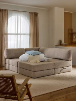 Divano letto angolare in bouclé con contenitore Ladina