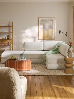 Divano letto angolare in bouclé con contenitore Ladina