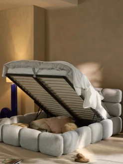 Letto imbottito in bouclé con contenitore Tayla