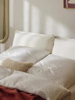 Letto imbottito in teddy-bouclé Amelia