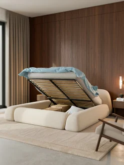 Letto imbottito in bouclé con contenitore Wolke