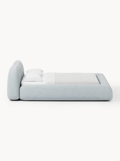 Letto imbottito in bouclé con contenitore Wolke