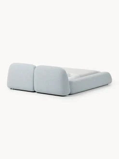 Letto imbottito in bouclé con contenitore Wolke