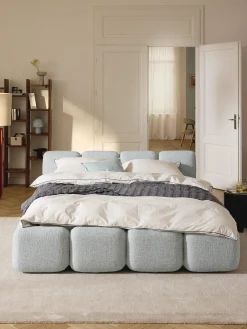 Letto imbottito in bouclé con contenitore Tayla