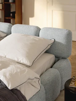 Letto imbottito in bouclé con contenitore Tayla