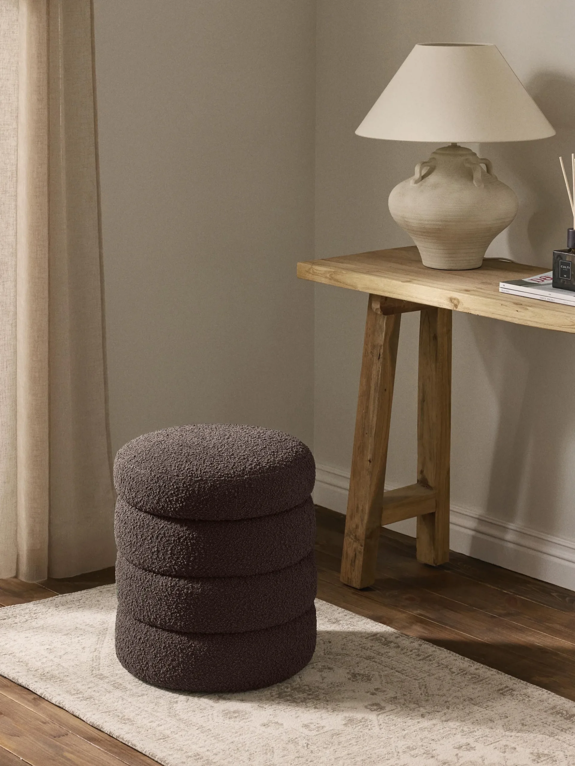 Pouf contenitore imbottito in bouclé Alto