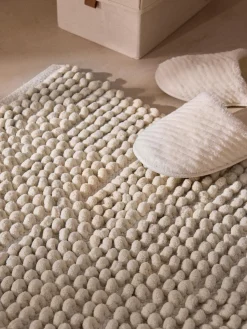 Tappetino da bagno morbidocon design ad anello Brady