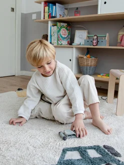 Tappeto rotondo per bambini lavabile fatto a mano con struttura in rilievo Wheels