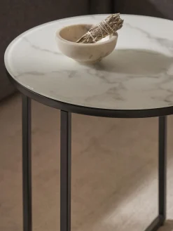 Tavolino rotondo con piano in vetro effetto marmo Antigua